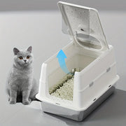 White covered litter box with flip-top panel open for scooping
